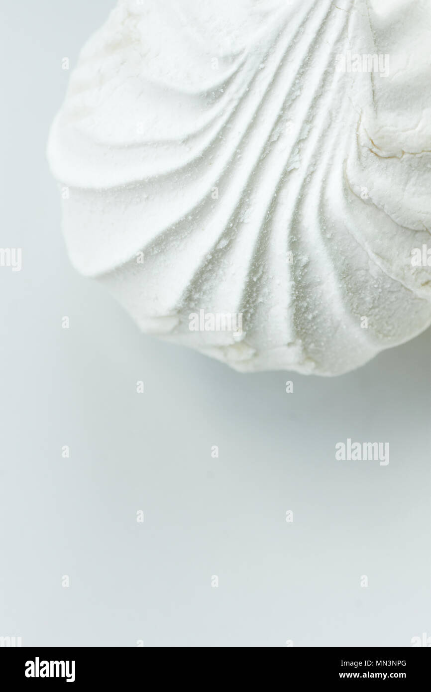 Big White Sea Shell Shaped Marshmallow. Elegant Styled Stock Image for Blogs Social Media. Monochrome. Baking Fashion Poster Banner Streamer Template. Stock Photo