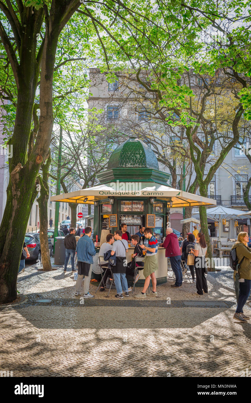 Kiosk Lisbon, view in spring of people at a popular kiosk in a corner of the Largo do Carmo in the Bairro Alto quarter of Lisbon, Portugal. Stock Photo