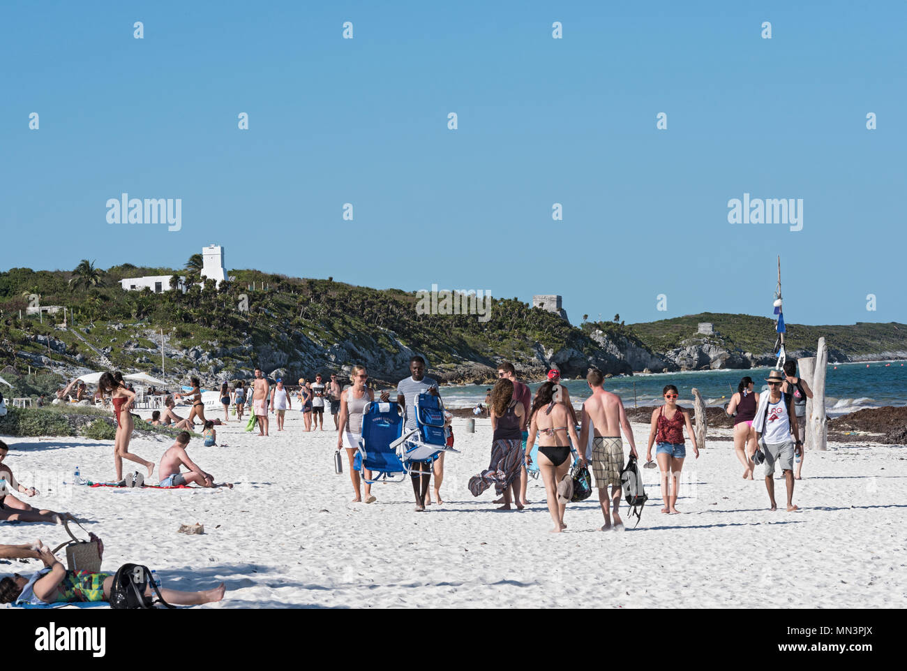 bathers on beautiful caribbean sand beach near the ruins of beautiful, mexico Stock Photo