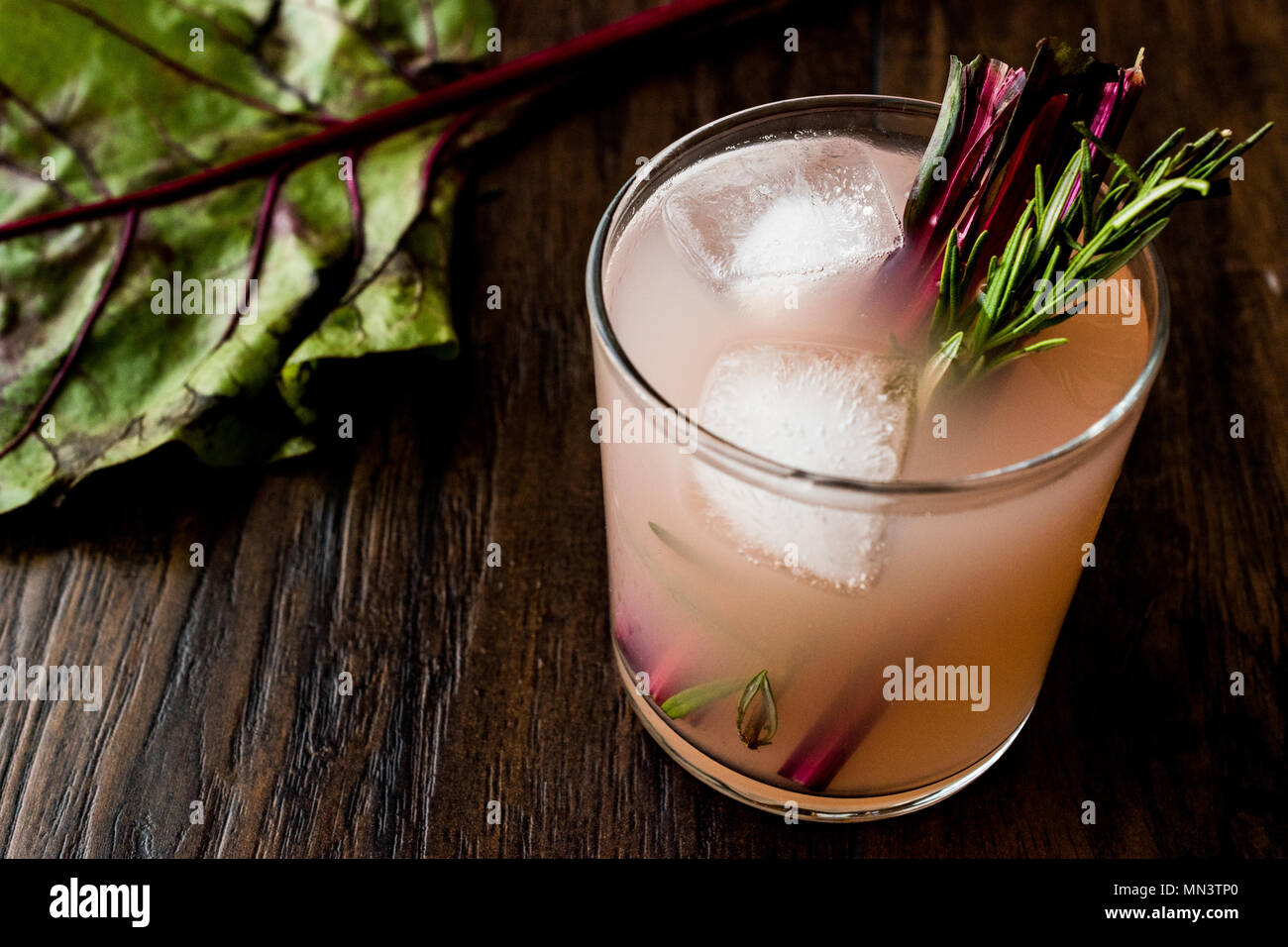 Rhubarb Cocktail with rosemary and ice. Beverage Concept Stock Photo Alamy