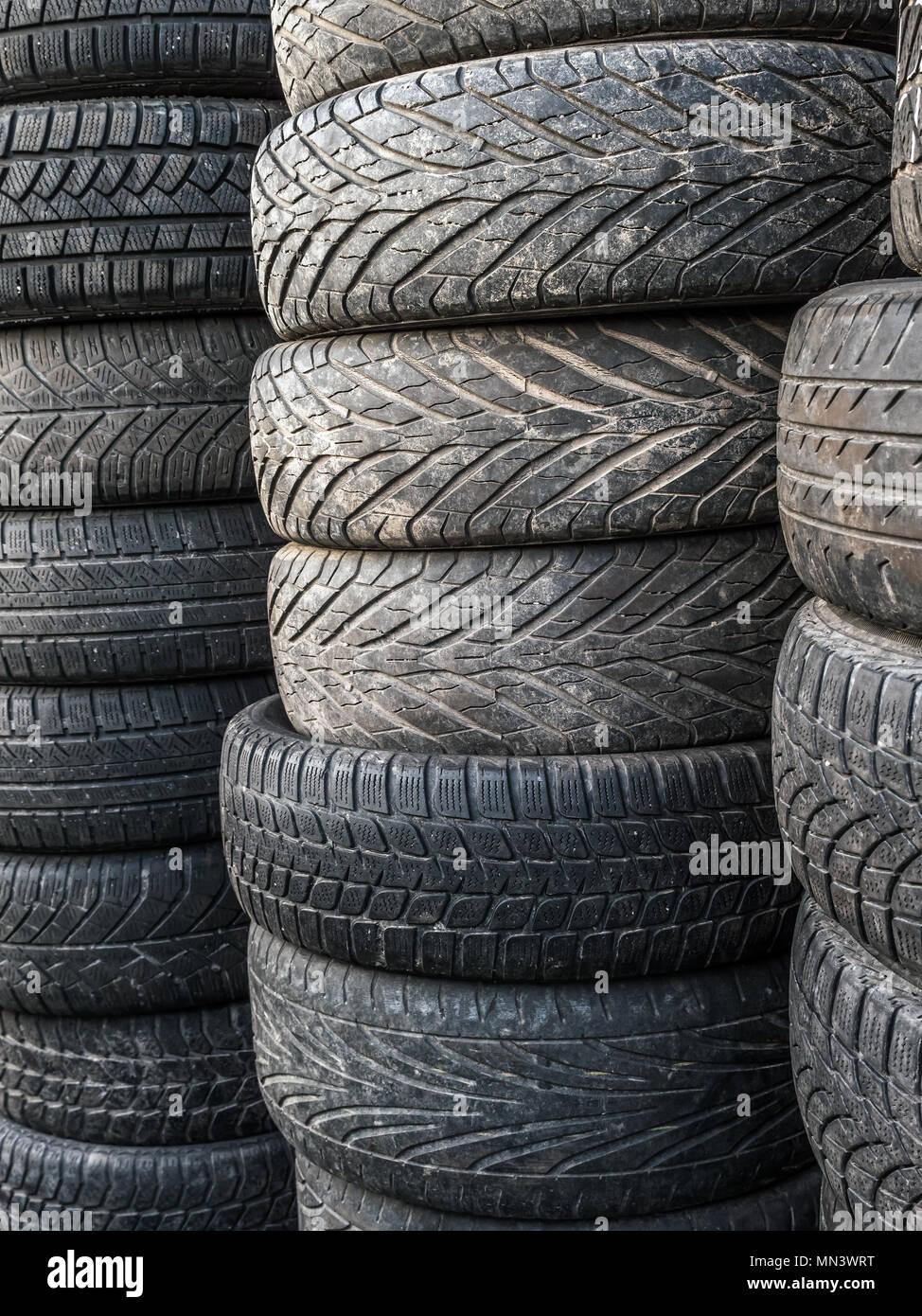 Piles of used and worn car tires Stock Photo