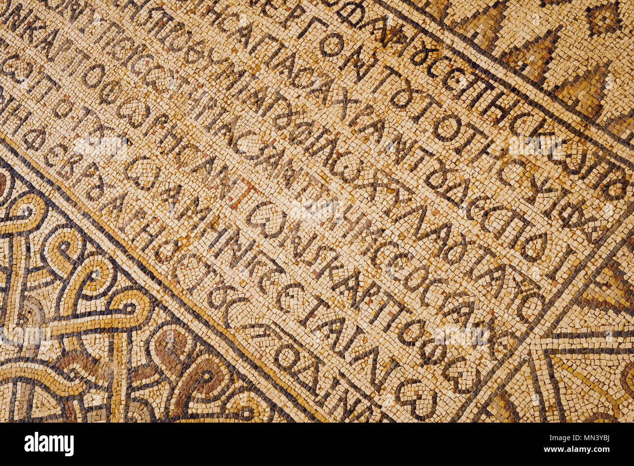 Ancient scriptures on a mosaic pattern in Madaba Archaeological Park ...