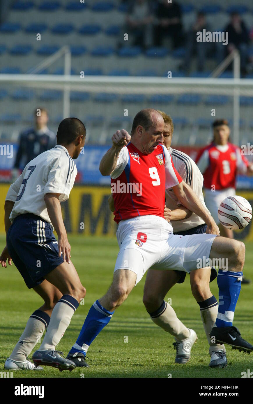 Jan Koller of Czech Republic, center battles for the ball with Keisuke Tsuboi, left, and Junichi Inamoto of Japan during the Internatinal Friendly match between Czech Republic 0-1 Japan at TYOTA Arena, Prague, Czech on April 28, 2004. Credit: AFLO SPORT/Alamy Live News Stock Photo
