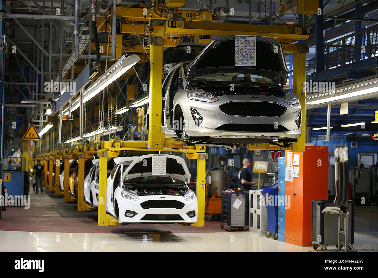 09 May 2018, Germany, Cologne: Ford Fiestas are on the conveyor belt at the manufacturing hall. Photo: Oliver Berg/dpa Stock Photo