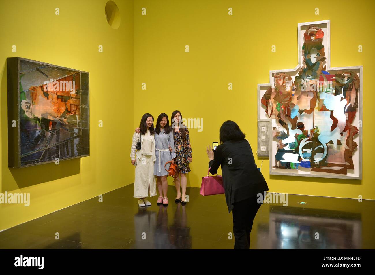(180514) -- BEIJING, May 14, 2018 (Xinhua) -- Visitors take photos during the 'Bridging the Gap: A Selection of Nominees of the Marcel Duchamp Prize' exhibition at Tsinghua University Art Museum in Beijing, capital of China, May 14, 2018. The exhibition, exhibiting the works of 10 artists selected for the Marcel Duchamp Prize, kicked off on Monday. (Xinhua/Xiao Xiao) (zyd) Stock Photo