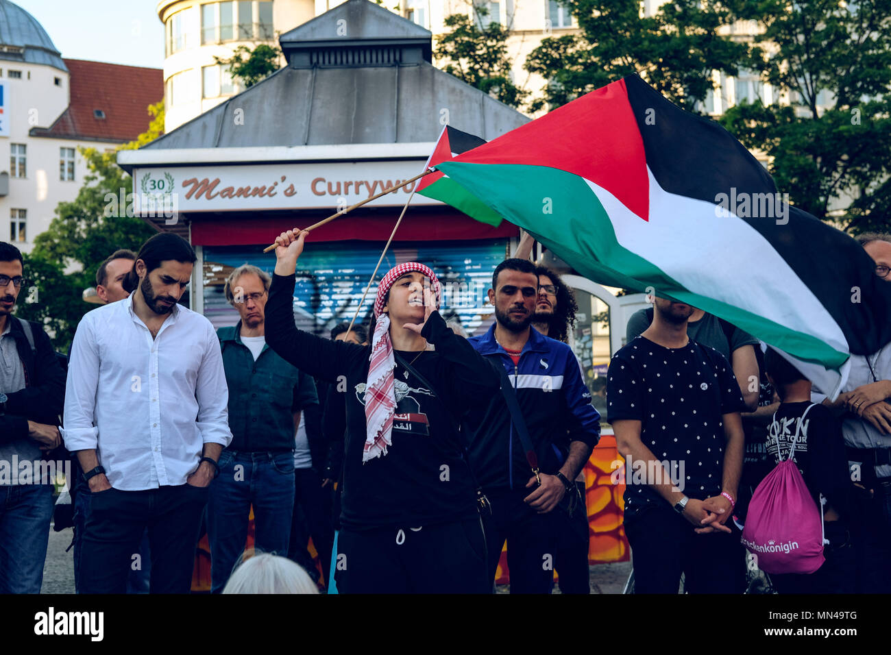 Berlin, Germany. 14th may 2018. Woman shouting at the protest in Berlin against the actions of Israel in Gaza where more than 50 people have been killed today. Hundreds of demonstrators gathering in Berlin to protest the violent actions that has been taken by the Israeli military in Gaza which has led to at least 50 dead. Credit: SOPA Images Limited/Alamy Live News Stock Photo