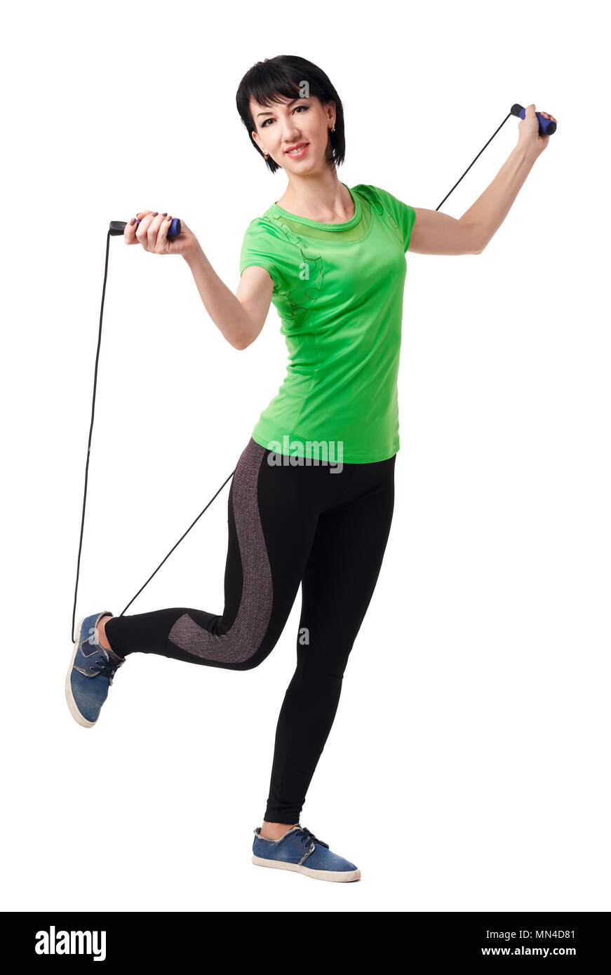 girl posing with skipping rope in studio, isolate on white background ...