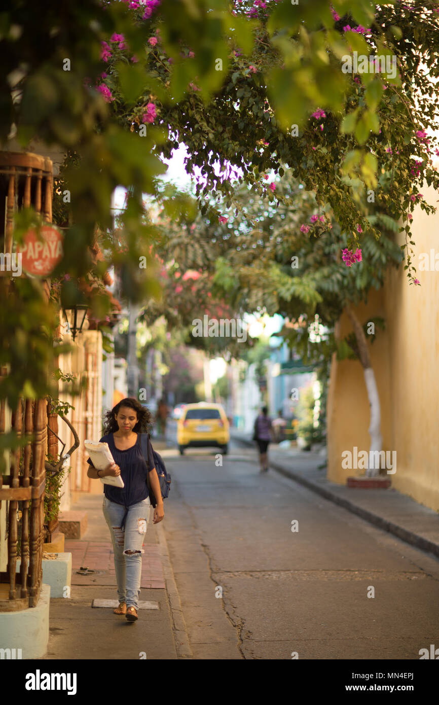 A woman on the colourful streets of Getsemani, Cartagena, Colombia Stock Photo