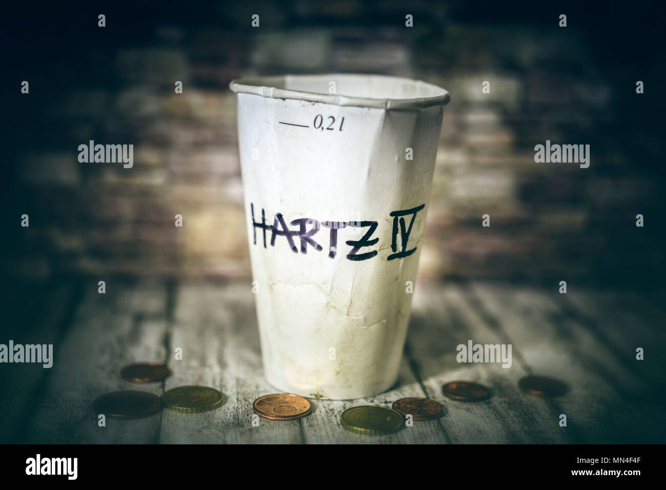 Donations cups with inscription Hartz IV, Spendenbecher mit Aufschrift Hartz IV Stock Photo