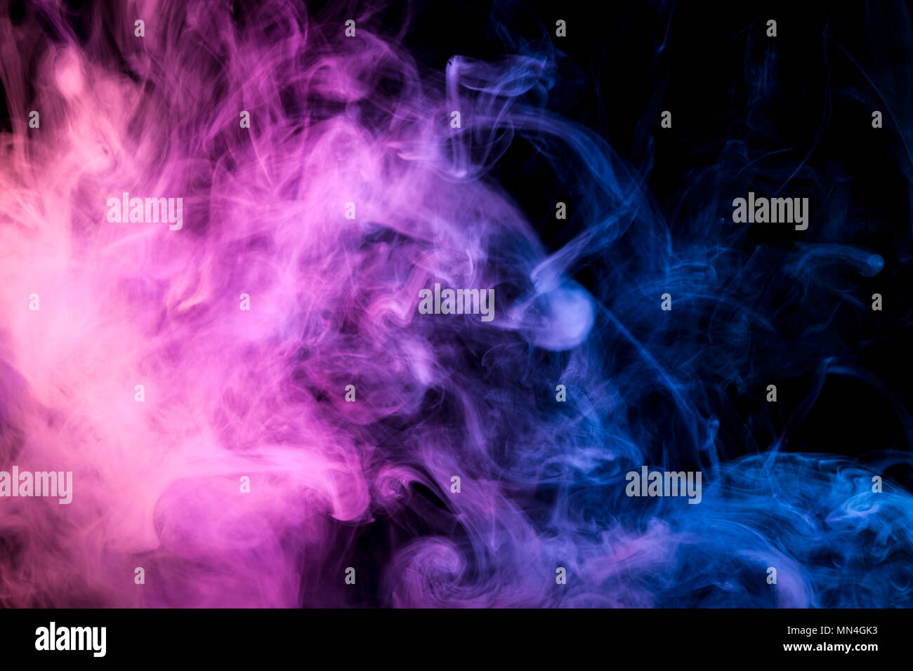 Blue and pink smoke on black background Stock Photo - Alamy