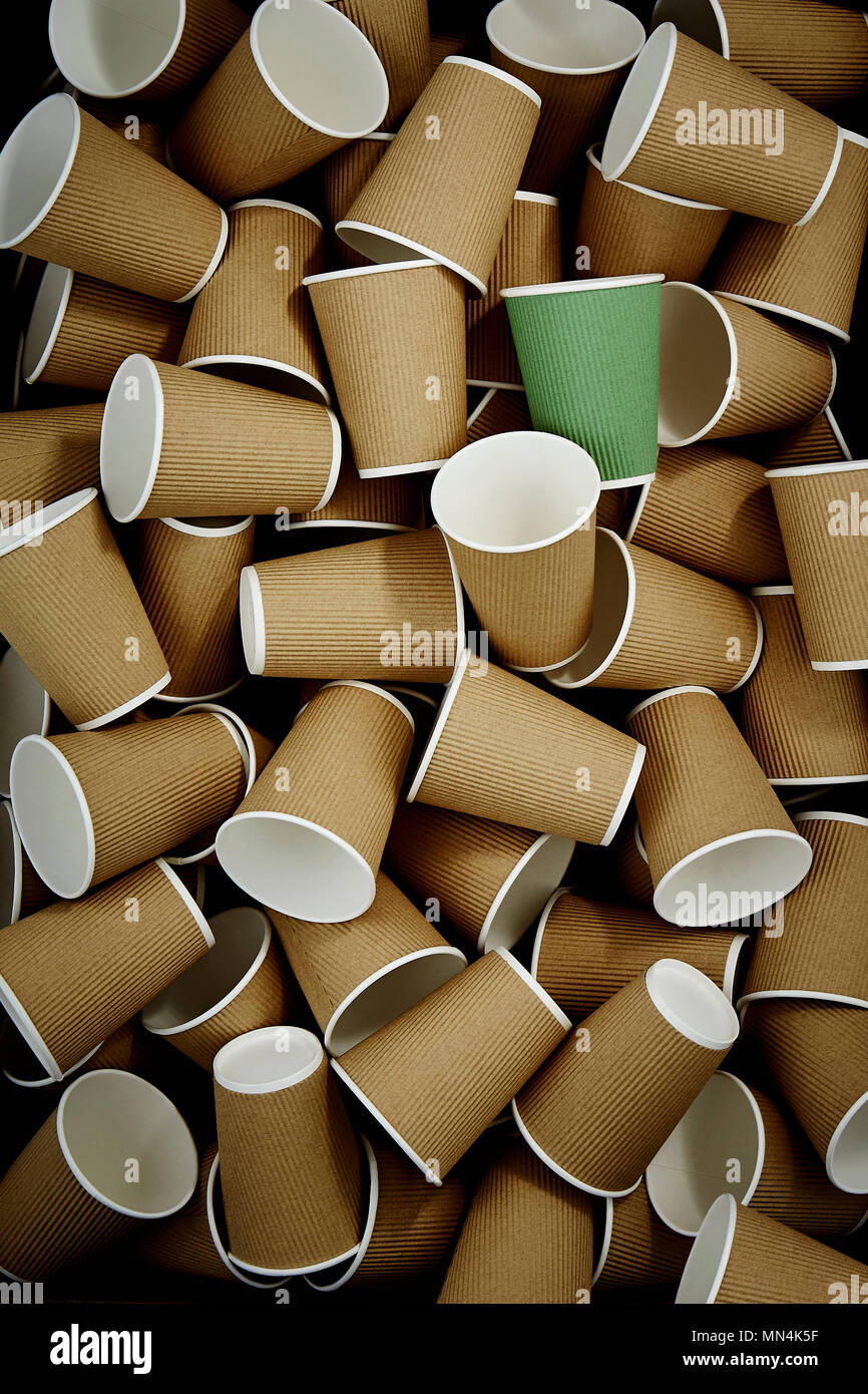 Full frame green recyclable coffee cup among disposable cups Stock
