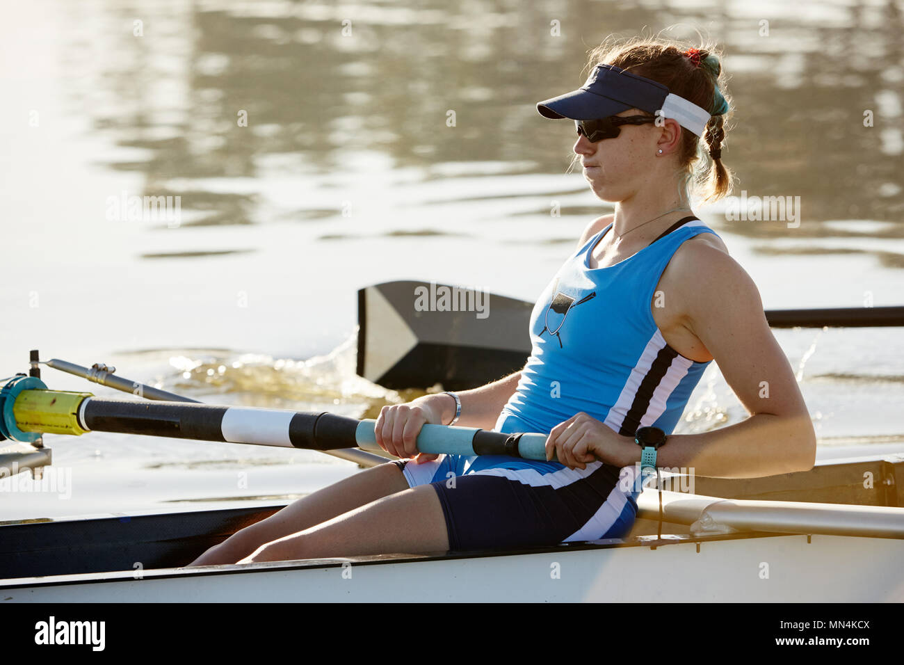 Determined female rower rowing scull Stock Photo
