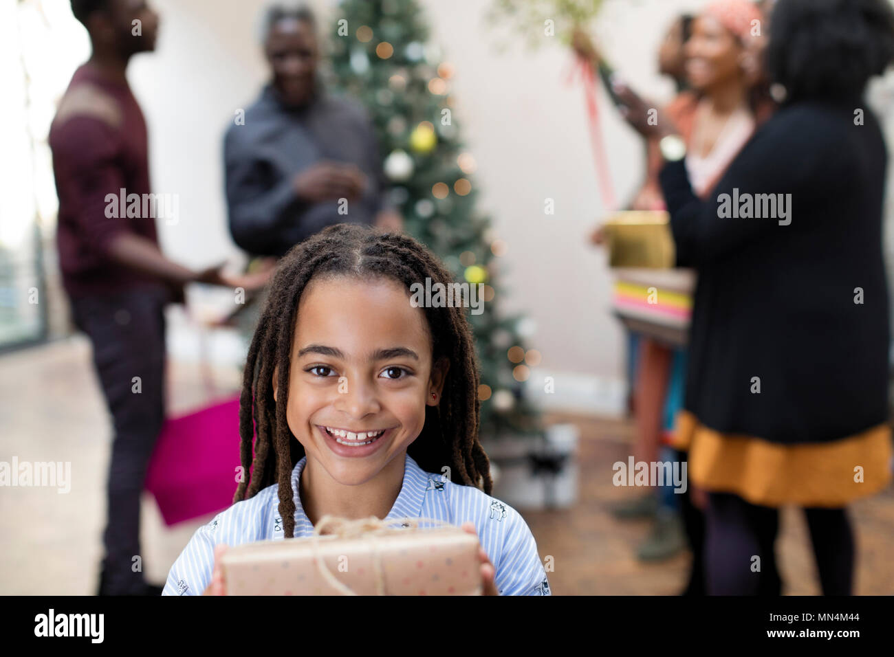 Portrait smiling girl with Christmas gift Stock Photo