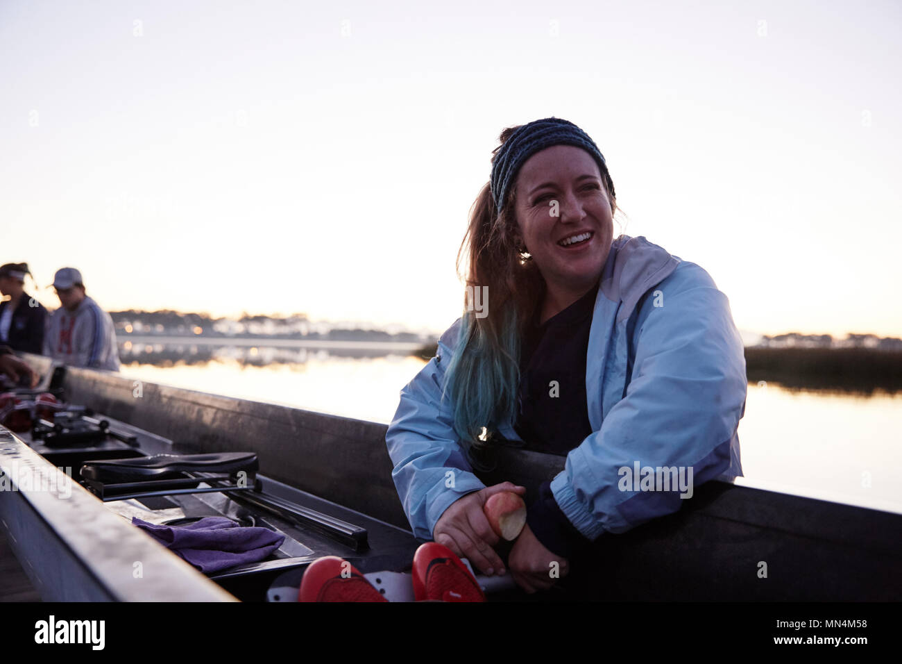 Portrait smiling, confident female rower at scull Stock Photo