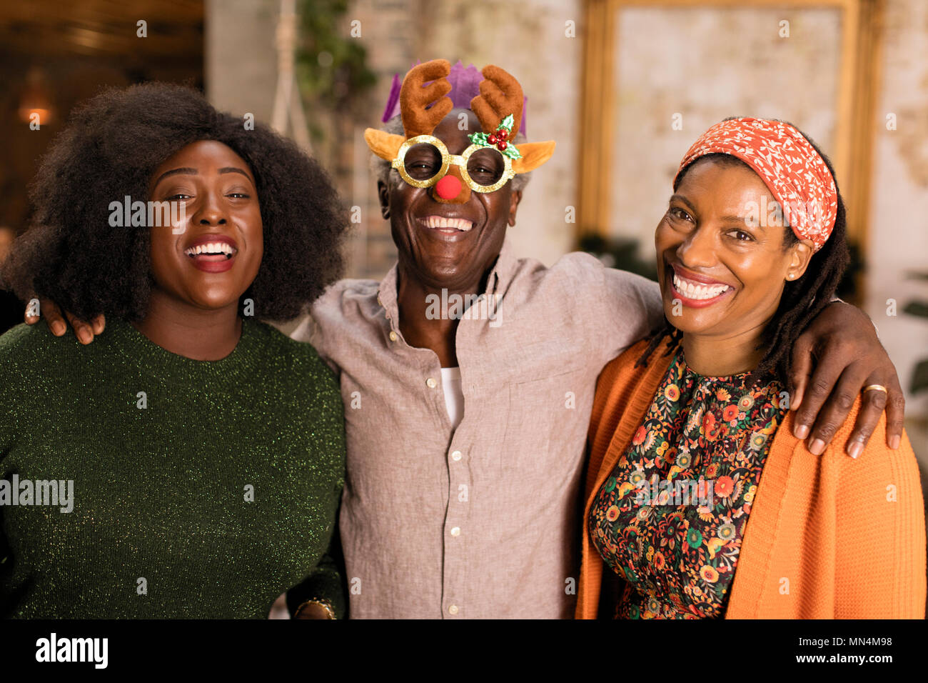 Portrait playful multi-generation family wearing Christmas costume goggles Stock Photo