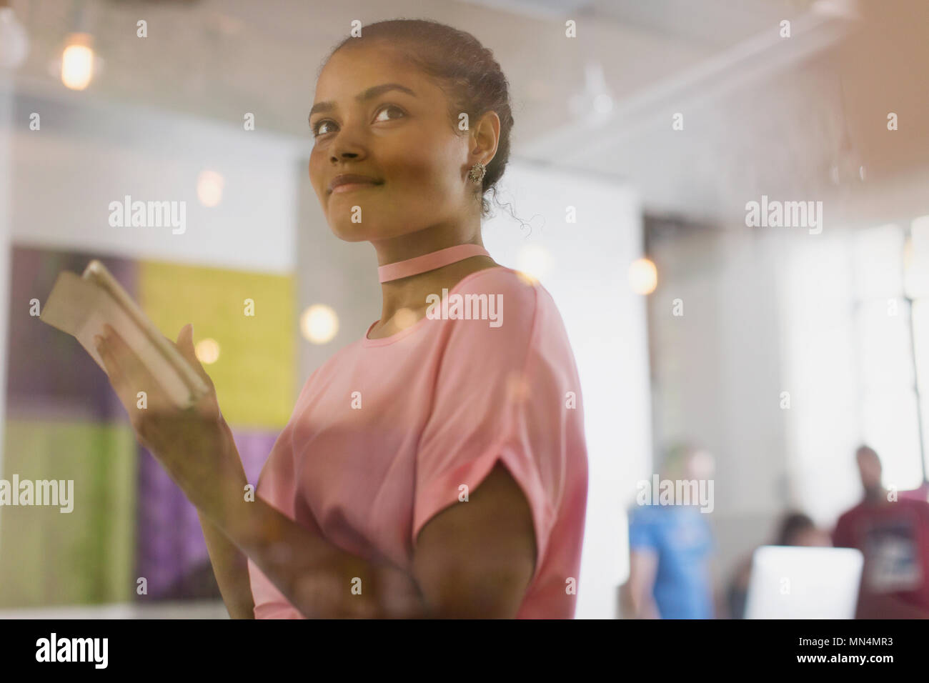 Confident businesswoman using digital tablet in office Stock Photo