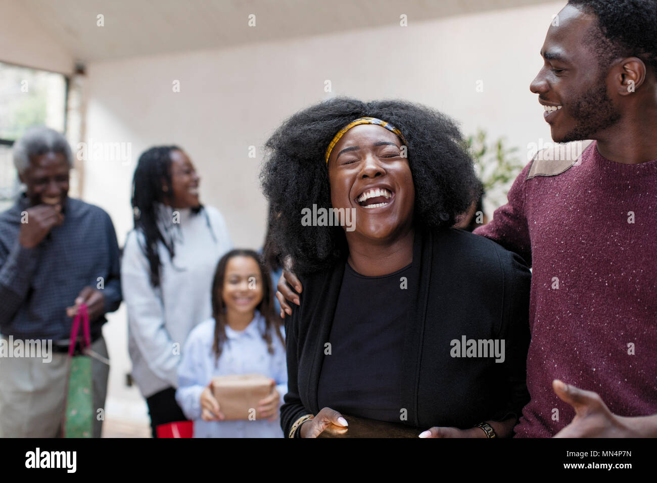 Happy, laughing multi-generation family gathering at Christmas Stock Photo