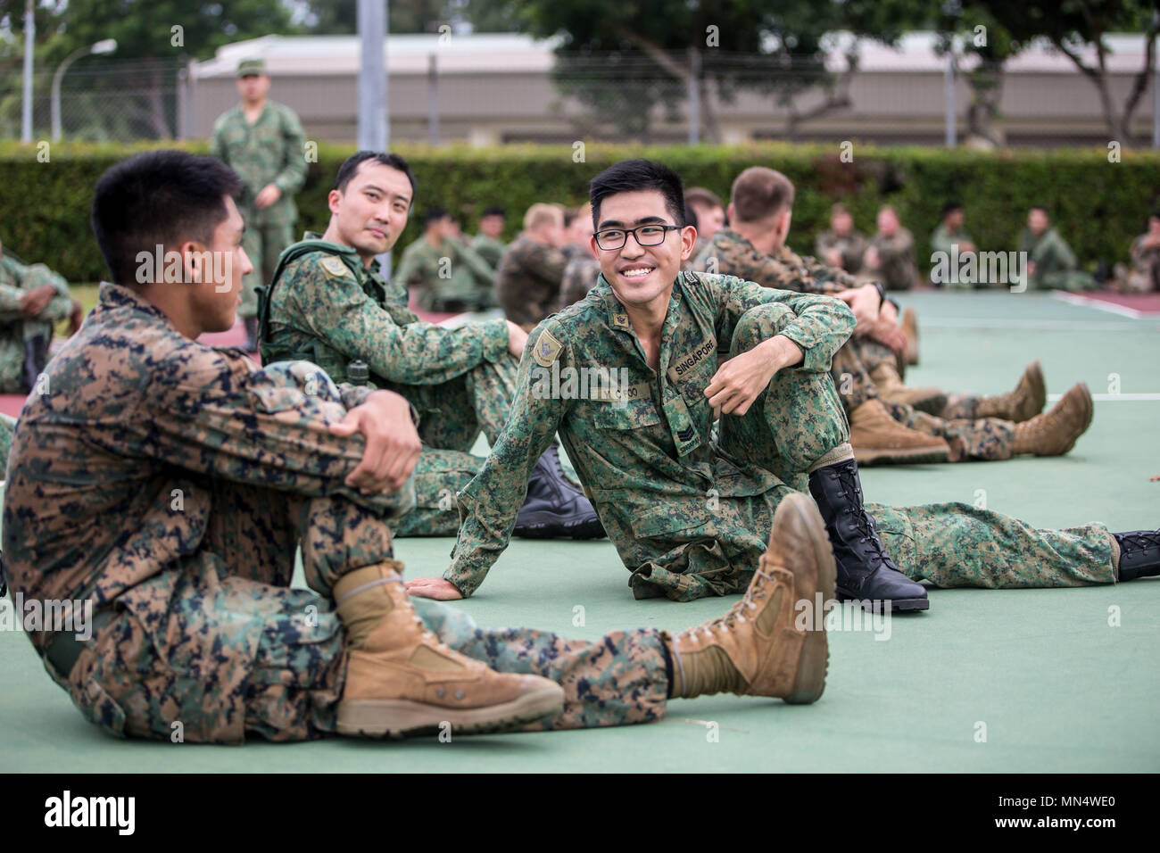 U.S. Marines and Singapore Armed Forces Soldiers stretch after U.S. Marines and Singapore Armed Forces Soldiers stretch after
