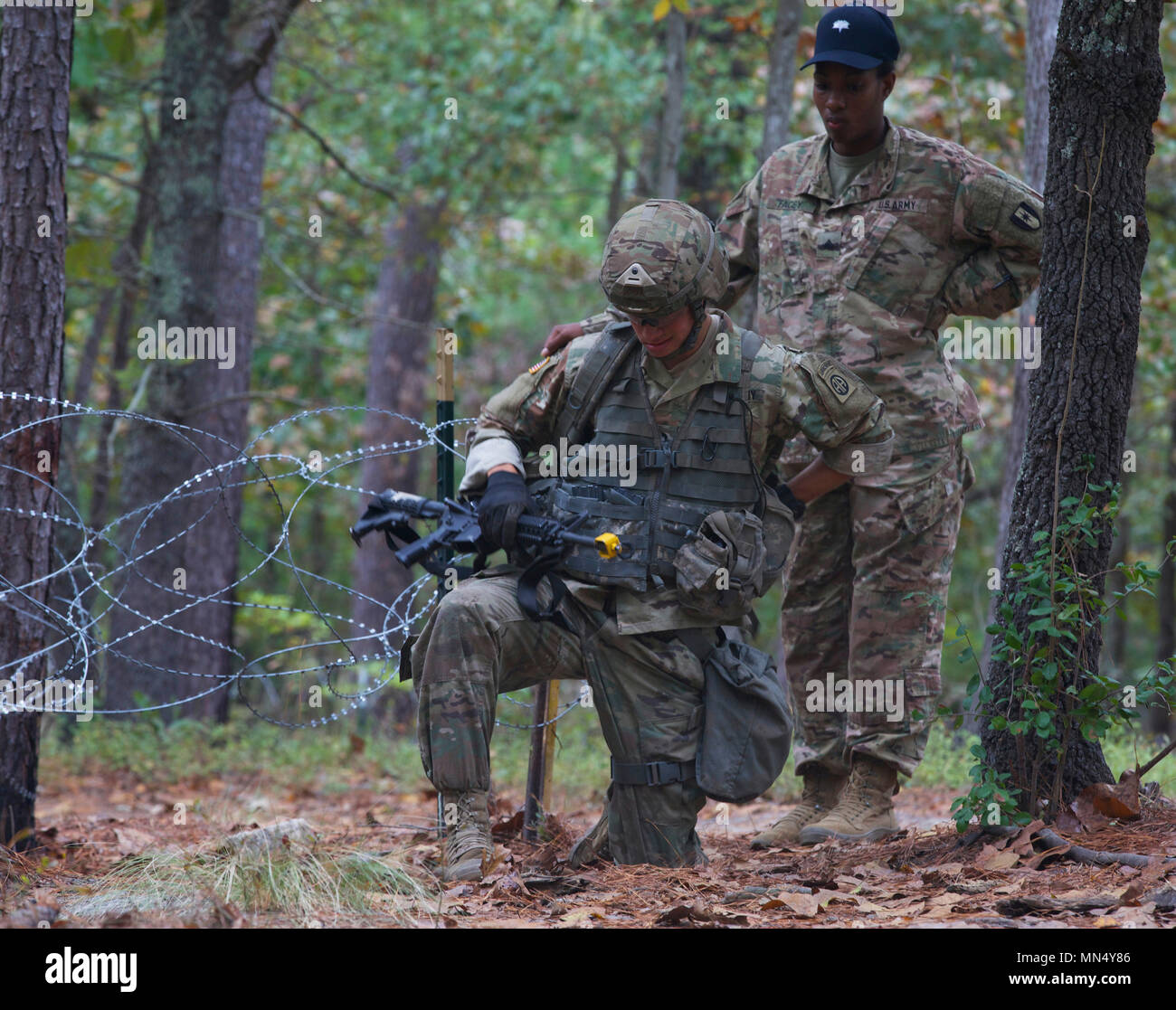 U.S. Armu soldier gets instructed during the the Expert Field Medical Badge (EFMB) on Fort Bragg, Nc., Oct. 16, 2017. The EFMB is awarded to U.S. Military personal who complete a set of tasks including both physical and mental exams. (U.S. Army photo by Pvt. Vincent Fausnaught.) Stock Photo