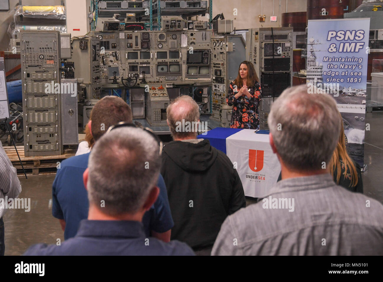 180508-N-VH385-0013 KEYPORT, Wash. (May 8, 2018) - Lindy Dosher, U.S. Naval Undersea Museum director, gives the opening remarks at a ceremony in which the Puget Sound Naval Shipyard and Intermediate Maintenance Facility donated the control room of the experimental nuclear research submarine, NR-1, to the museum. The control room was removed from NR-1 during the recycling process at the shipyard and reassembled for transfer to the museum. Launched on Jan. 25, 1969, NR-1 was the only nuclear-powered research submarine ever built, and carried out classified and unclassified operations for almost  Stock Photo