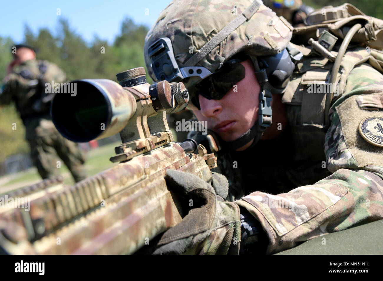 Spc. Daniel Bocon, Seattle native, infantryman assigned to 1st Squadron,  2nd Cavalry Regiment, fires the Polish army Sako TRG sniper rifle during a  multinational weapons range with Battle Group Poland at Bemowo