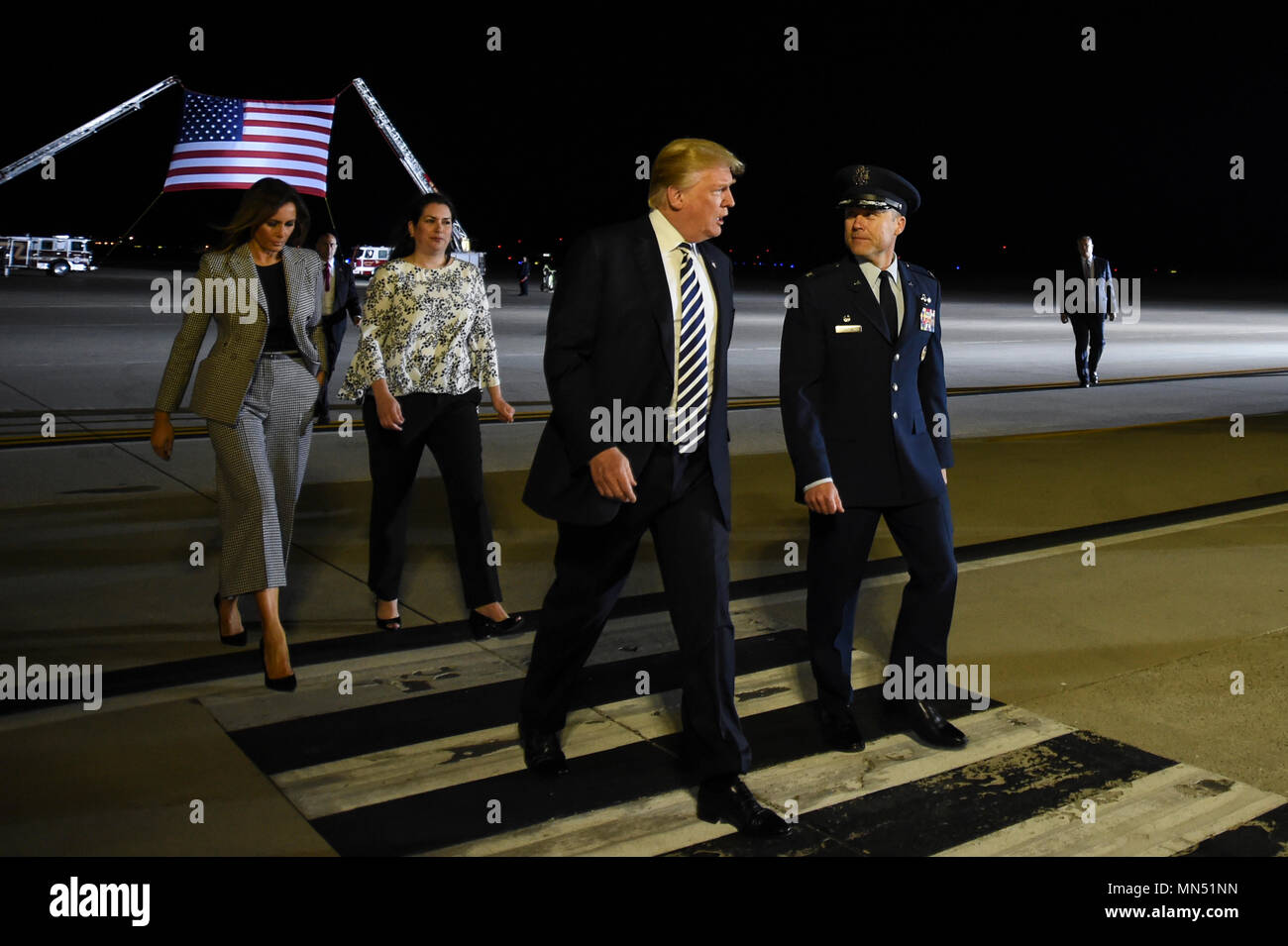 President of the United States Donald J. Trump and First Lady Melania Trump walks with Col. Casey D. Eaton, 89th Airlift Wing commander and his wife Lisa Eaton at Joint Base Andrews, Md., May 10, 2018 as they prepare to greet three Americans who were freed from North Korea on May 9, 2018. An 89th AW C-40 high-priority personnel transport aircraft carried Kim Dong-chul, Tony Kim and Kim Hak-song from North Korea to Anchorage, Alaska where the plane refueled before arriving at JBA at 3 a.m. EST. The 89th AW executes special missions such as these on a routine basis while enabling national intere Stock Photo