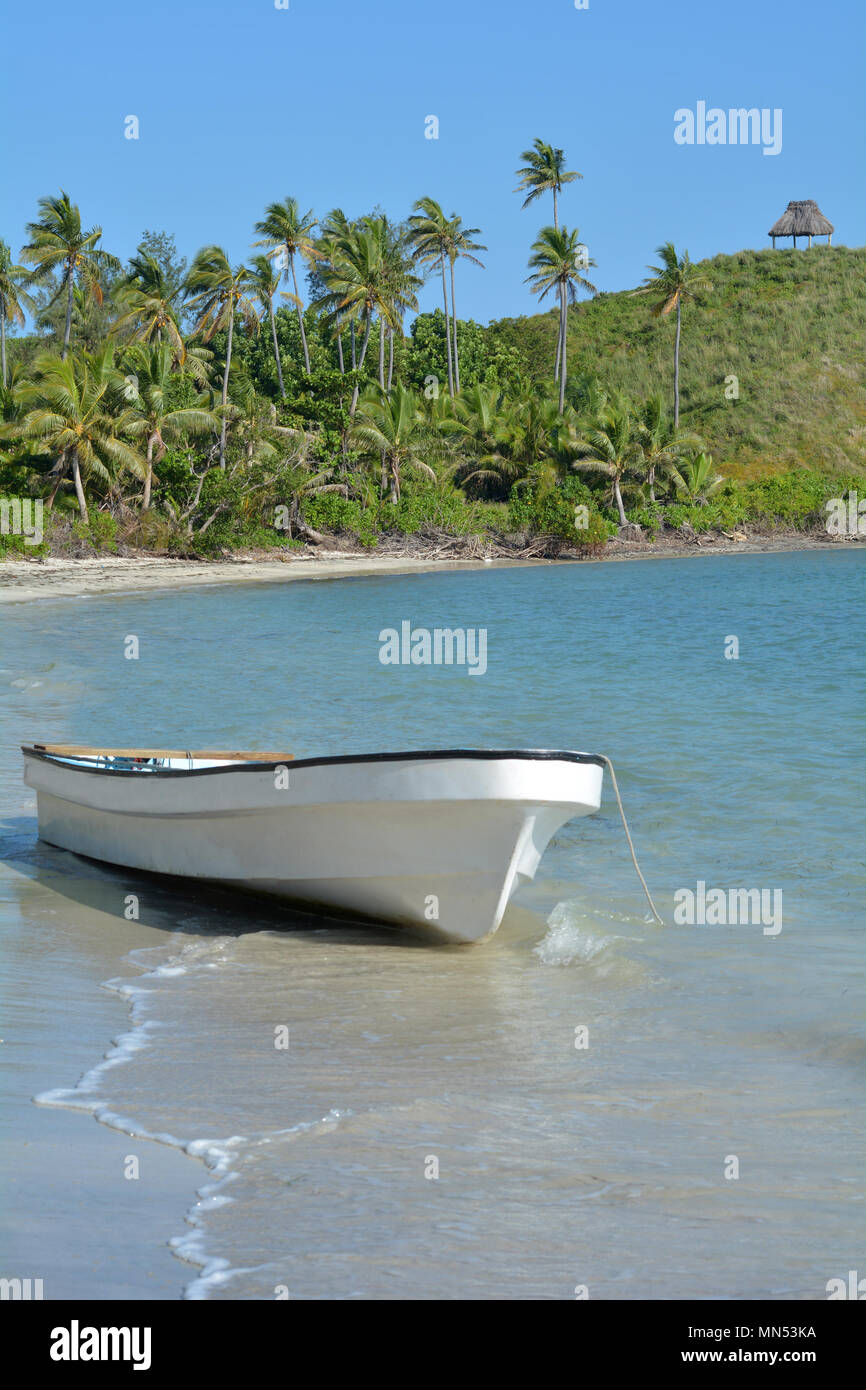 White Fishing Boat On A Tropical Island In The Yasawa Islands Group Fiji White Fishing Boat On A Tropical Island In The Yasawa Islands Group Fiji