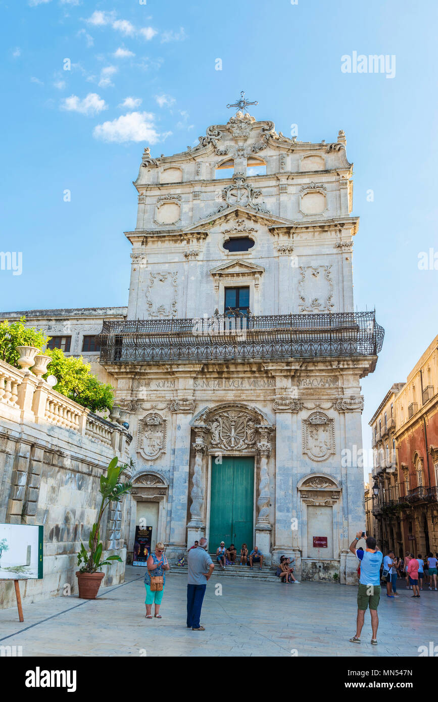 Siracusa, Italy - August 17, 2017: Facade of the church of Santa Lucia Alla Badia in the Piazza Duomo with people around in Siracusa, Sicily, Italy Stock Photo