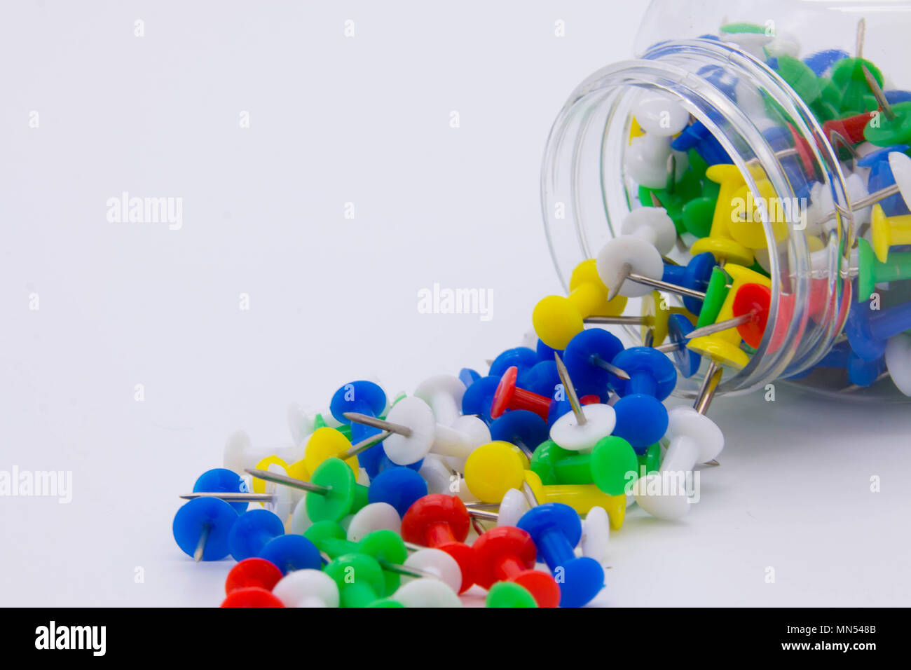 Pile of plastic notice board push pins on a white background Stock