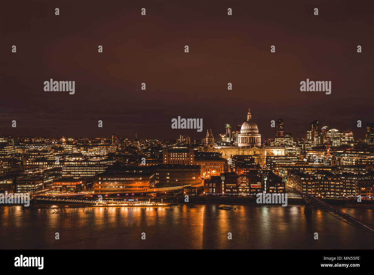 London aerial view of modern city skyline at night on the River Thames Stock Photo