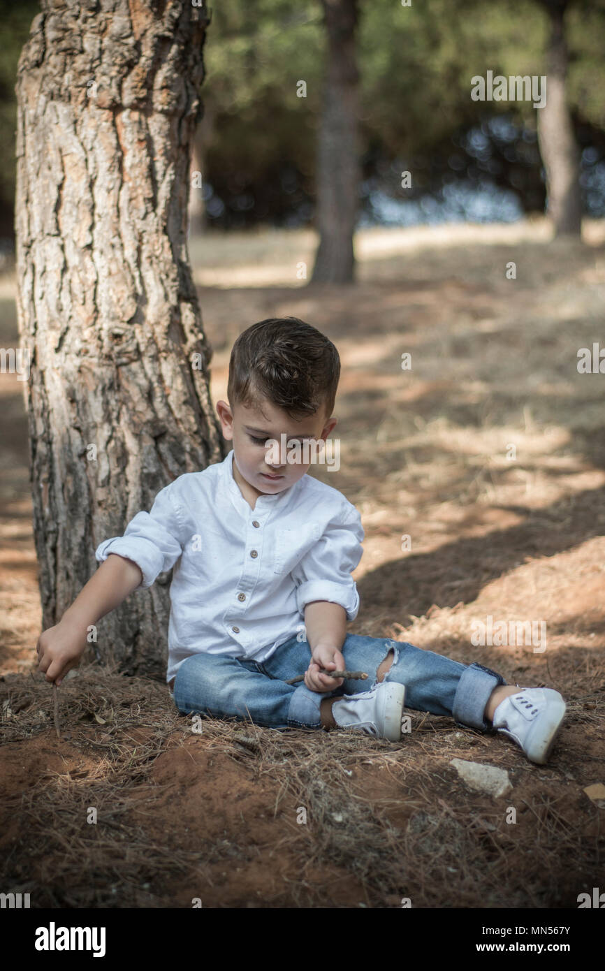 Boy playing in the park hi-res stock photography and images - Alamy
