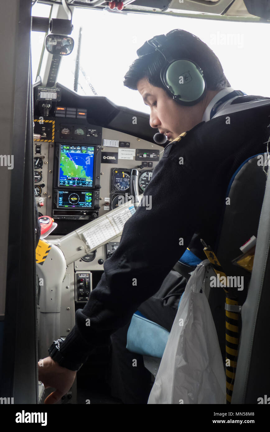 Pilot at work, Newquay to St. Mary's Skybus, DHC-6 Twin Otter Stock Photo