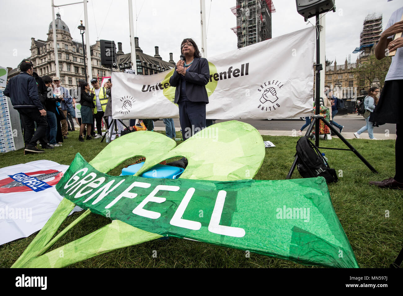 Diane Abbott speaking to protesters in front of the British Parliament. Protesters gathered in Parliament square in central London to demand justice for the victims of the Grenfell tower fire last year. Stock Photo