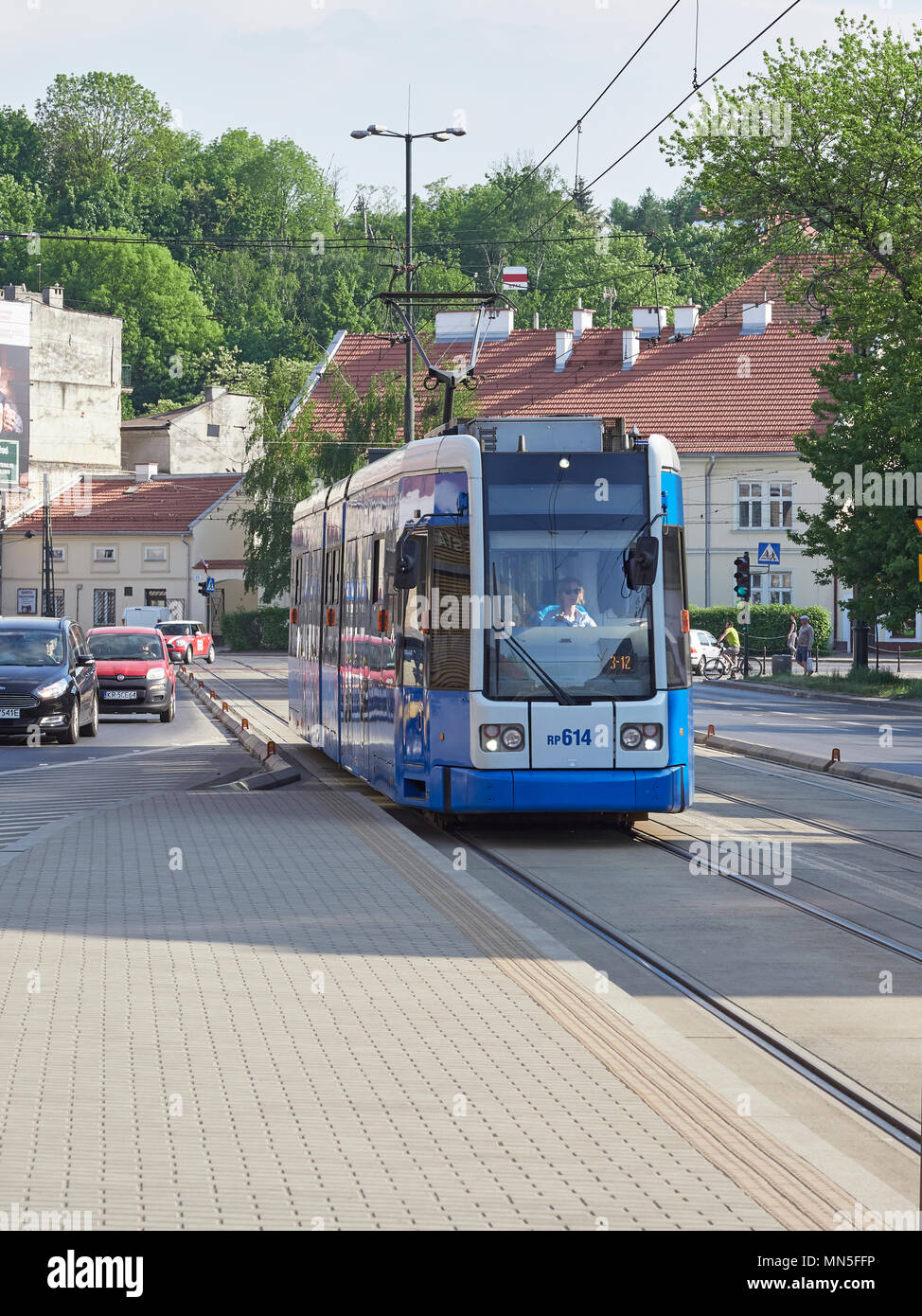 Krakow tram arriving at the Ghetto Heroes Square or Plac Bohaterow stop in Stock Photo