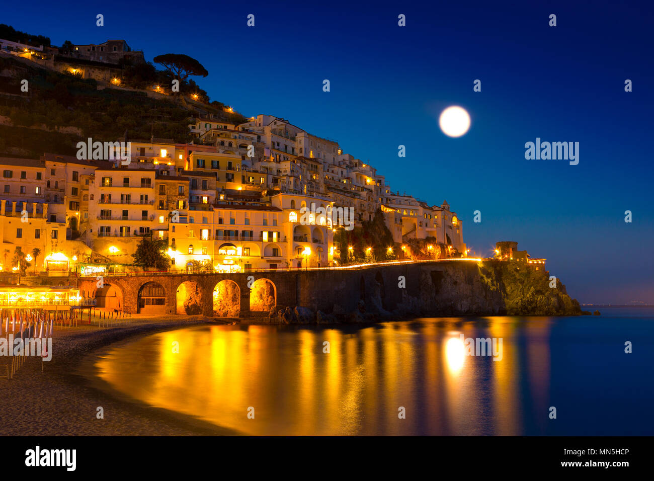Night view of Amalfi on coast line of mediterranean sea, Italy Stock