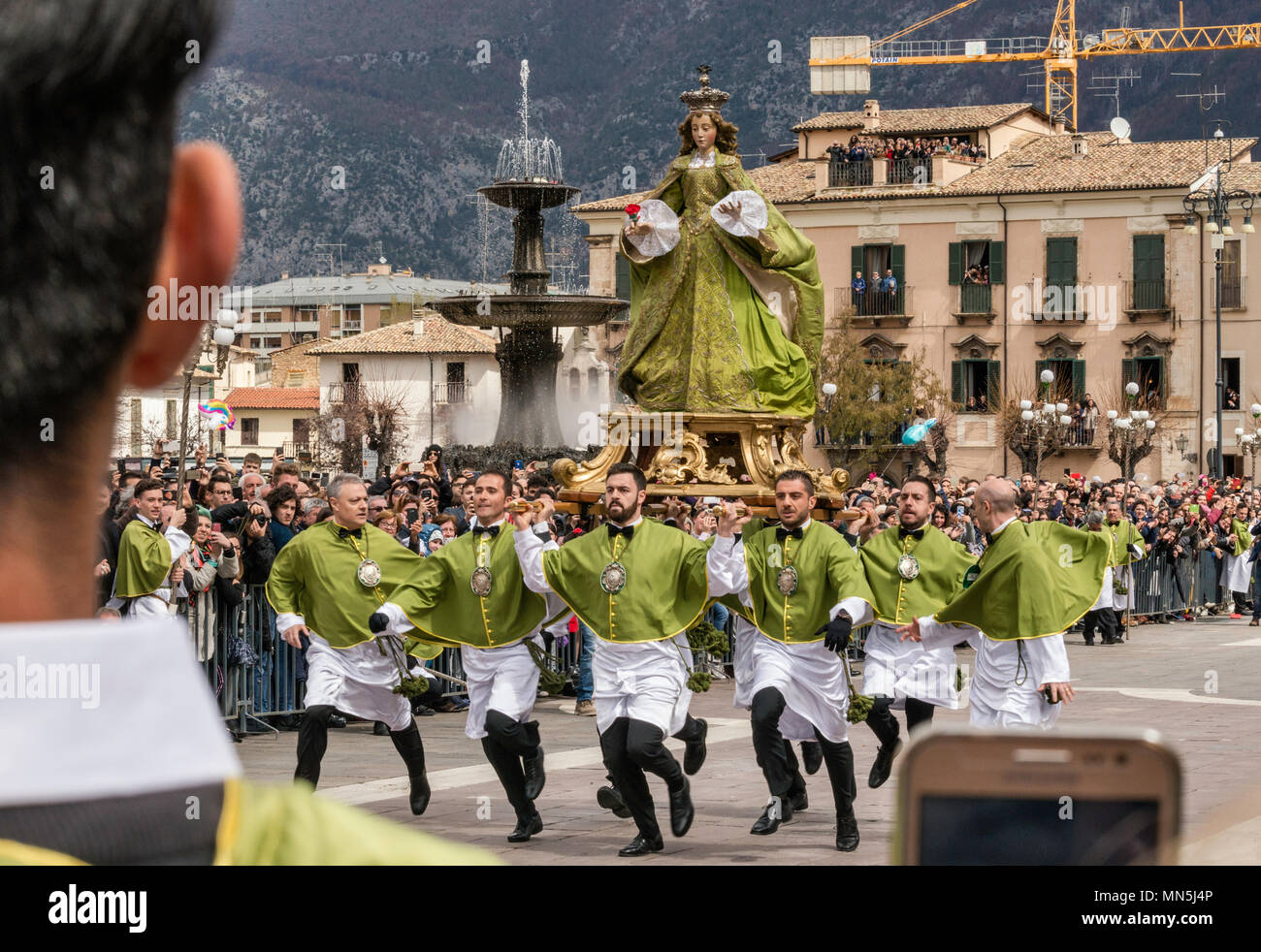 Members of Confraternity of Madonna di Loreto, running, carrying Madonna figure to Risen Christ figure, at Madonna che Scappa celebration on Easter Su Stock Photo