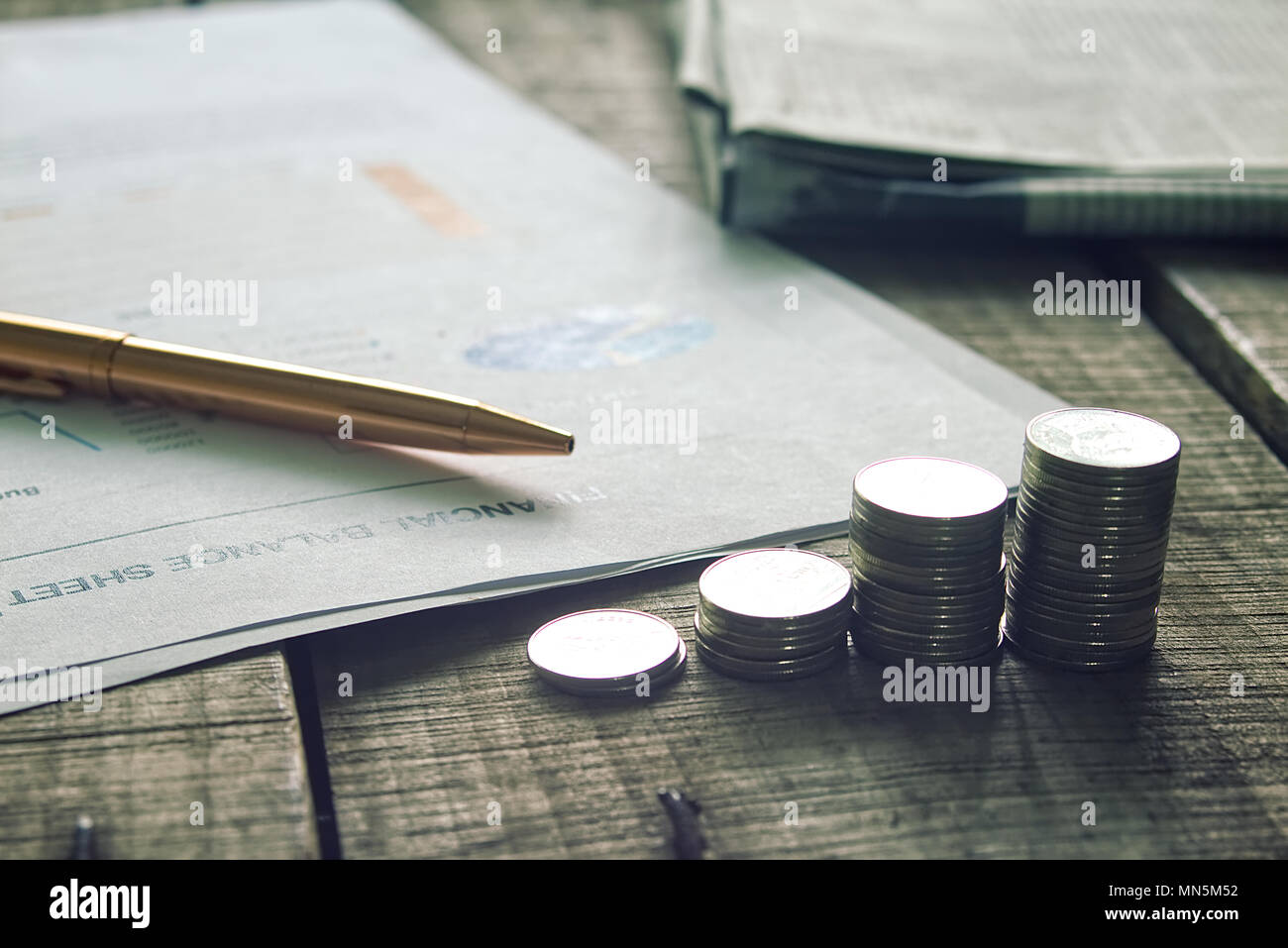 Stack of money on working desk, business concept. Stock Photo
