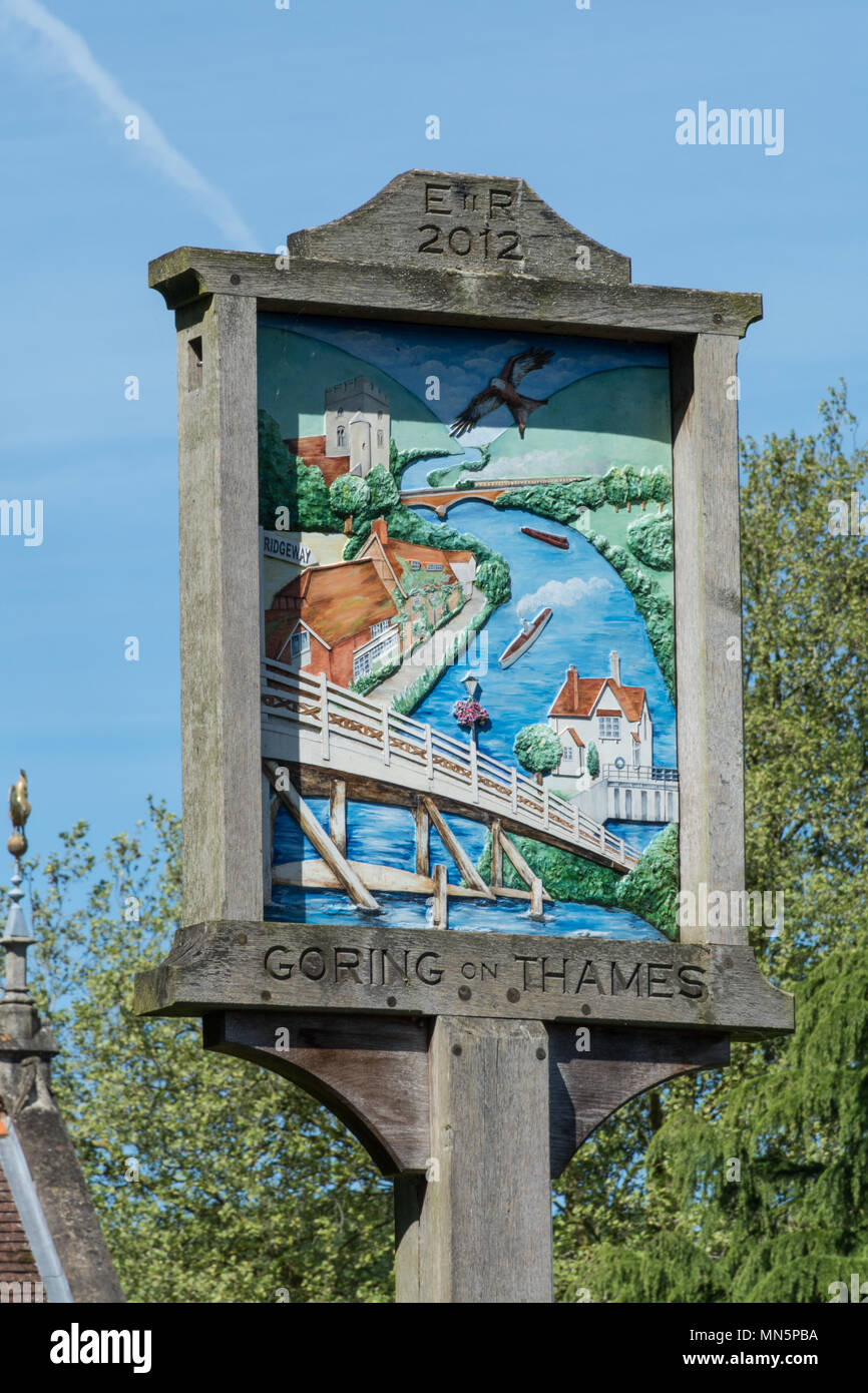 Decorative wooden village sign in Goring-on-Thames in Oxfordshire, UK Stock Photo