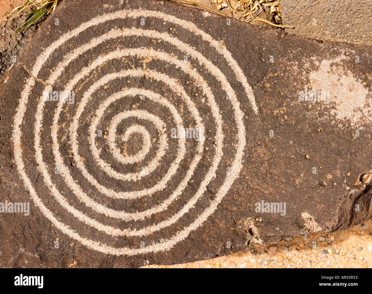Spiral circle of life petroglyph. Ancient Pueblo etching located at Petroglyph National Monument, Albuquerque, New Mexico. Stock Photo