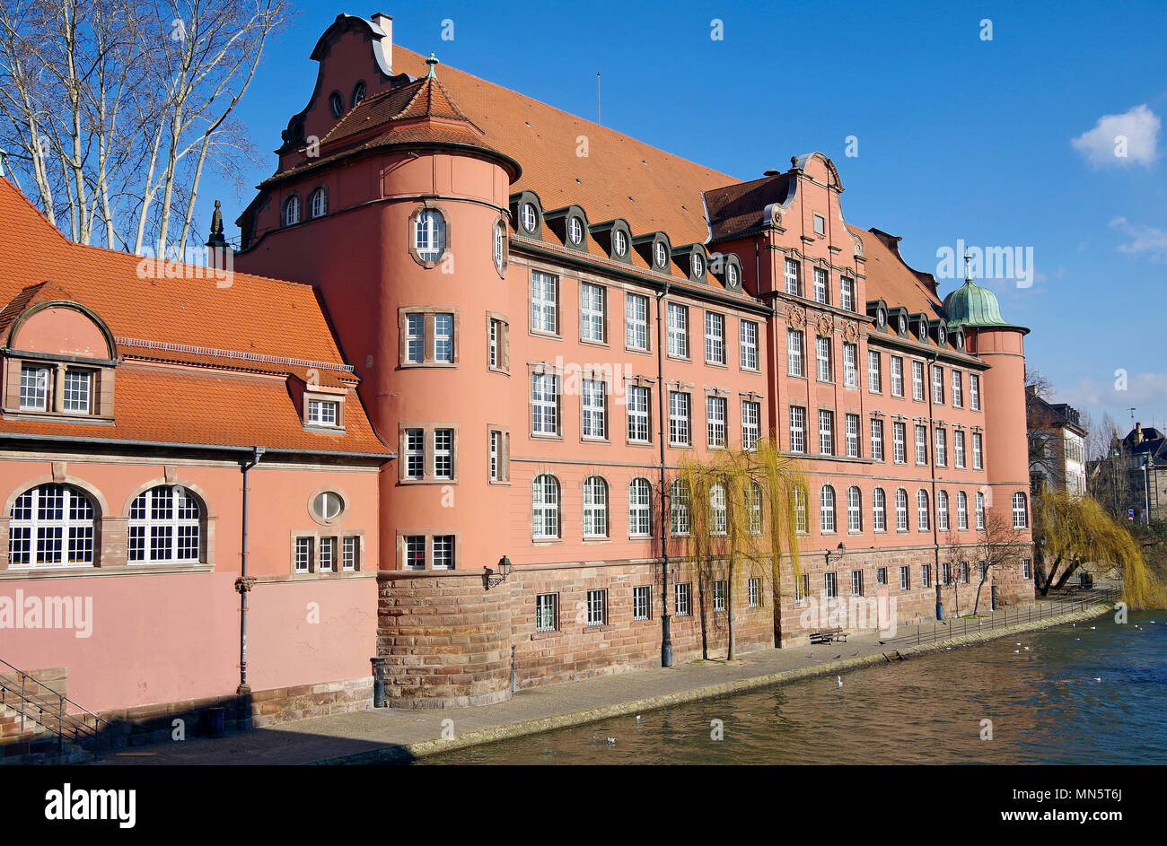 St Thomas’s school, Ecole St Thomas, in Strasbourg, viewed from the Pont St-Martin, facing the river Ill Stock Photo