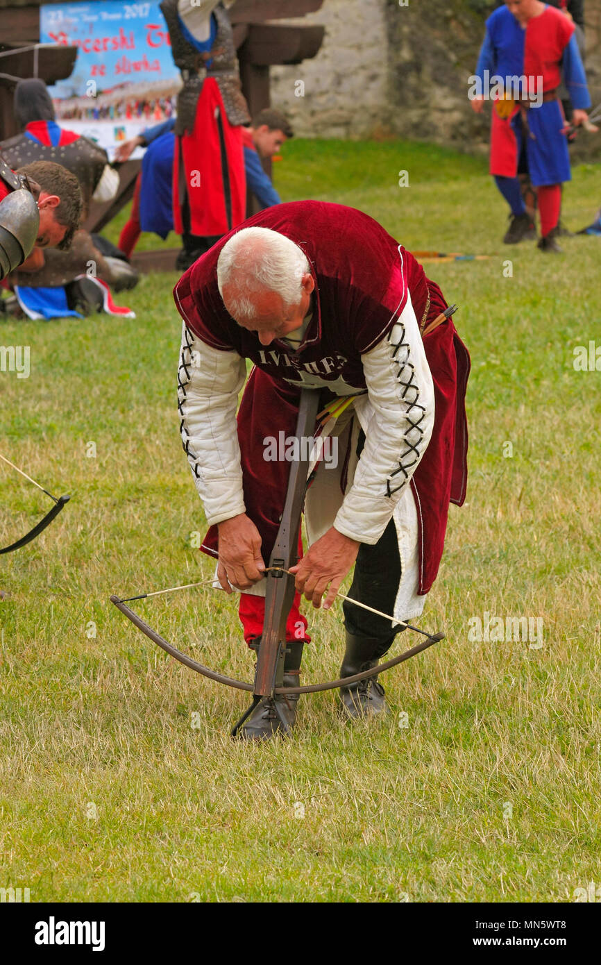 Crossbow man. Show by members of The Knightly Order of St. George of Visegrad (Hungary). 'Knight's Tournament with Plum'. Szydlow, Poland. Stock Photo