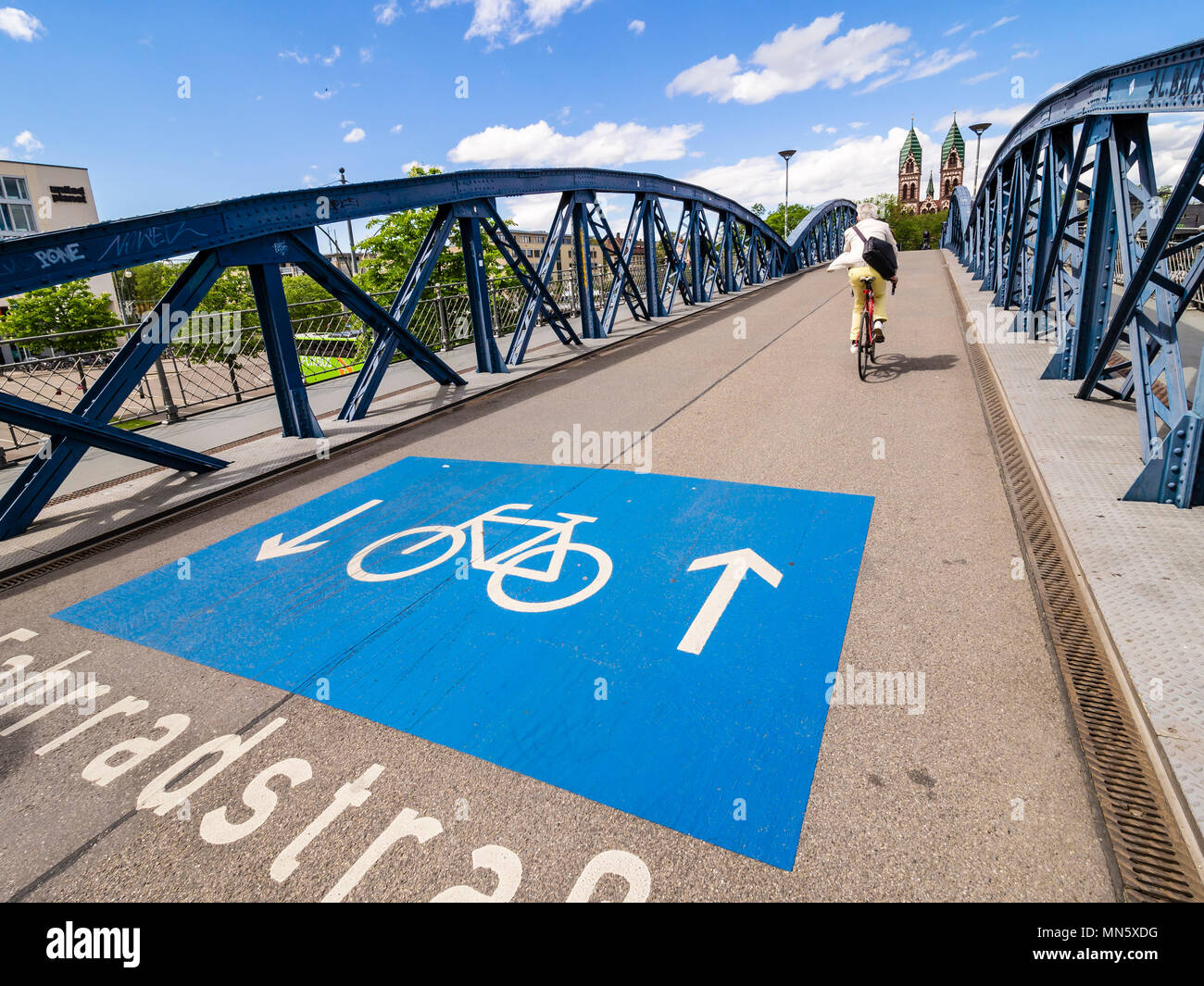 Bicycle-only road, Fahrradstrasse, on bridge Wiwilíbrücke,Wiwilíbridge, blue bridge, Stühlingerbridge, Herz-Jesu church, Freiburg, Breisgau, Baden-Wür Stock Photo