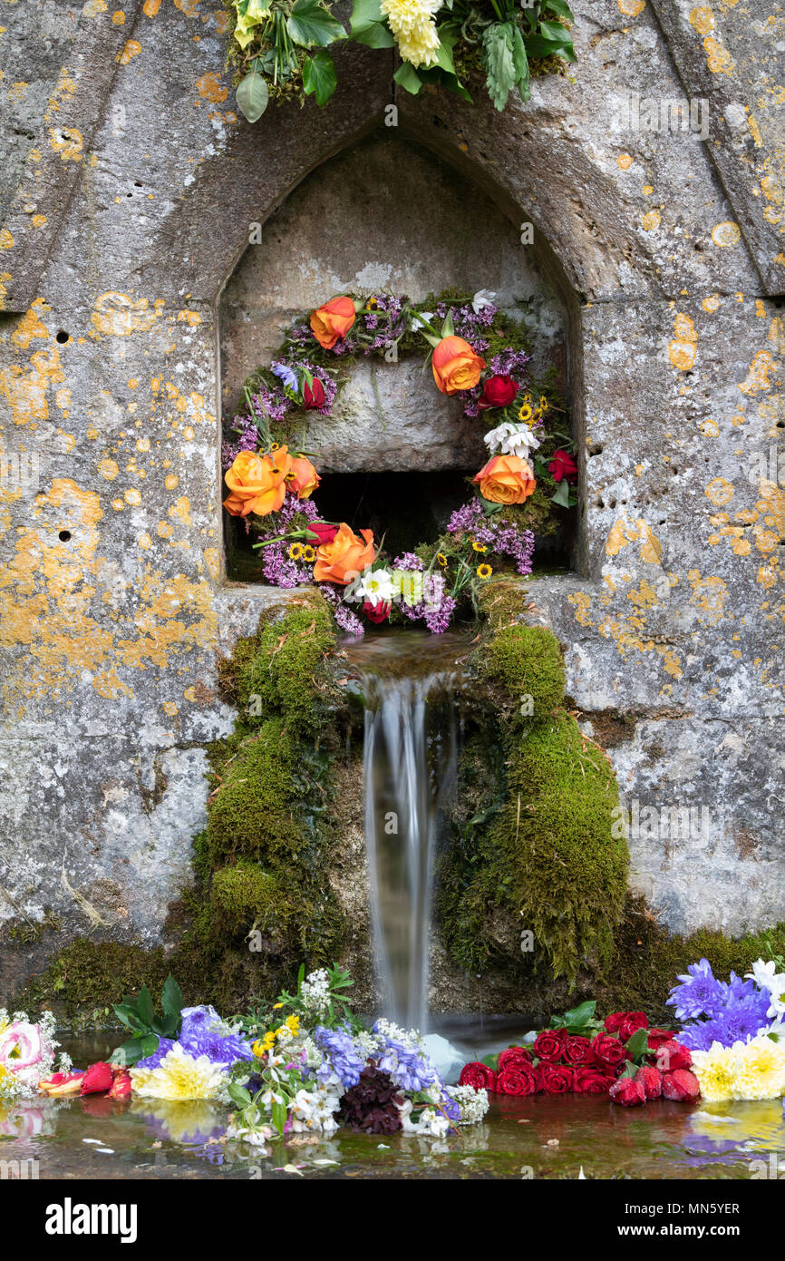 Bisley well dressing ceremony. Floral decorations on 7 wells in bisley celebrating Ascension Day. Bisley, Cotswolds, Gloucestershire, England Stock Photo