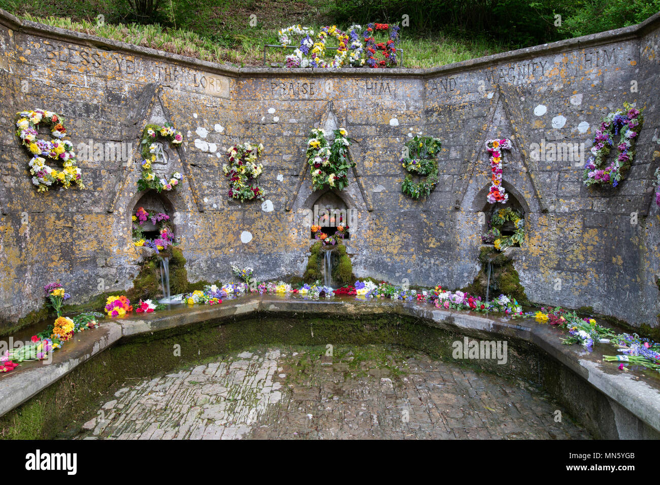 Bisley well dressing ceremony. Floral decorations on 7 wells in bisley celebrating Ascension Day. Bisley, Cotswolds, Gloucestershire, England Stock Photo