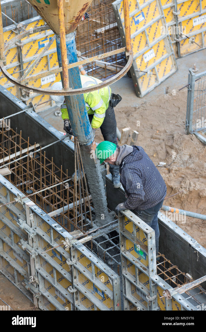 concrete placement in framed formwork Stock Photo
