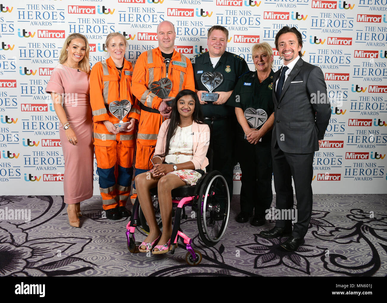 Katie Piper (left) and Richard Hammond (right) present the Emergency  Lifesaver Award at the NHS Heroes Awards to London Air Ambulance's Caroline  Appleby and Vidar Magnusson (both wearing orange), and paramedics James