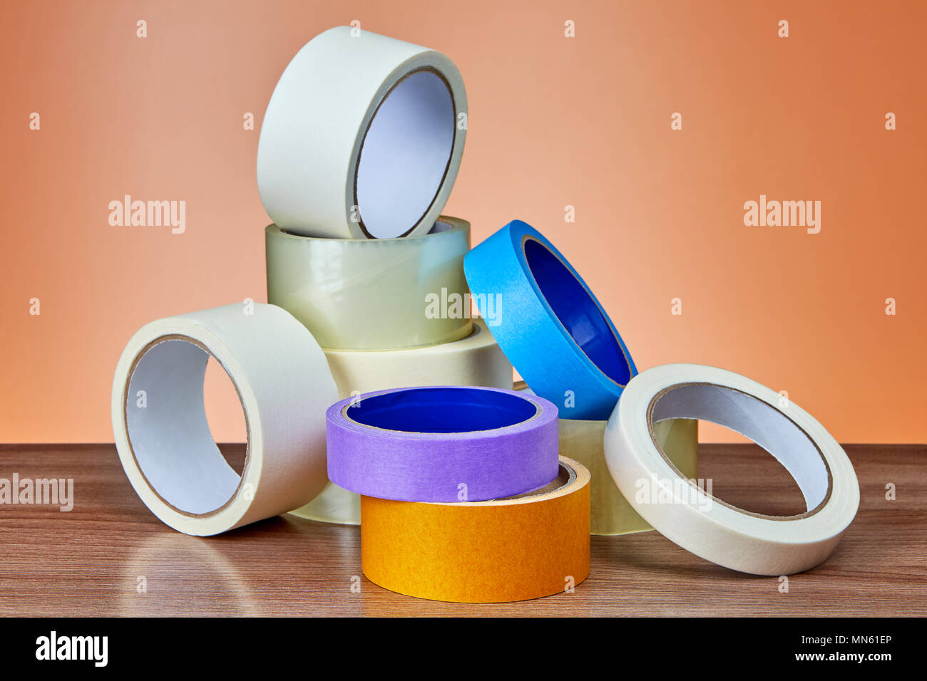 A heap of packing tape and a masking tape on an orange background Stock  Photo - Alamy
