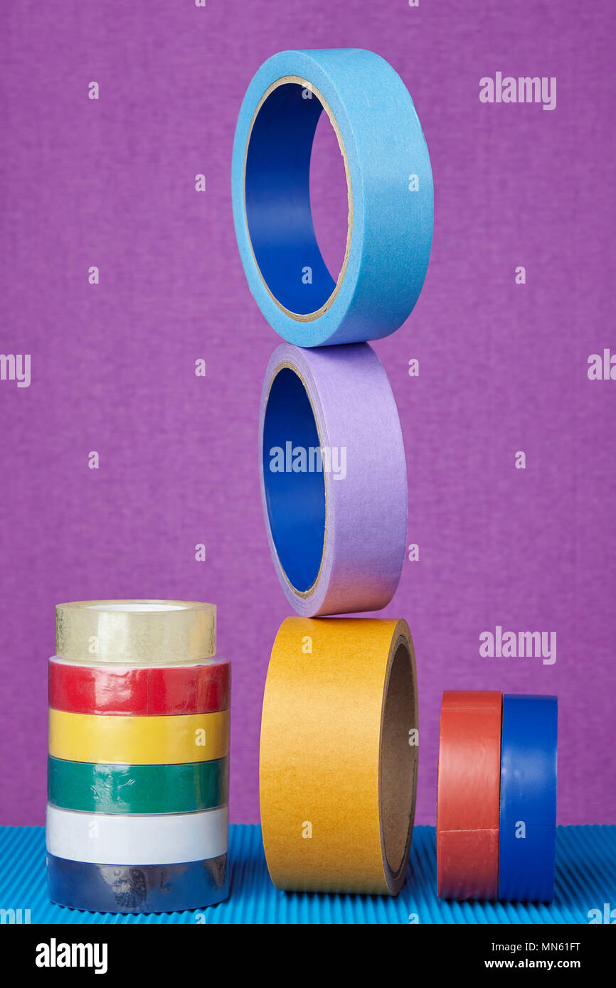 Multicolored rolls of sticky tape on lilac background Stock Photo Alamy