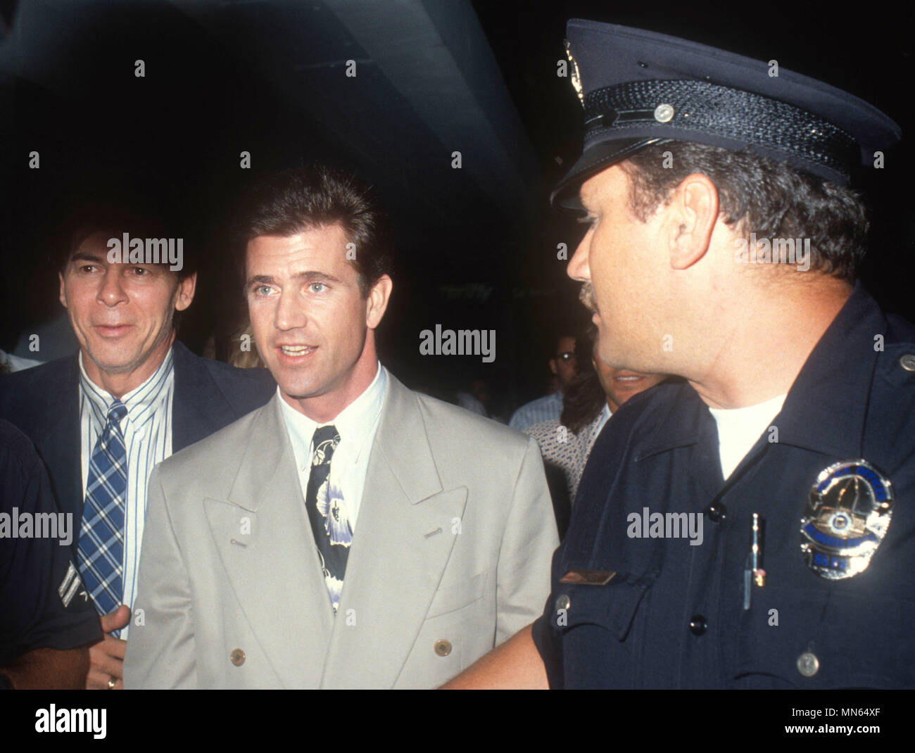 HOLLYWOOD, CA - AUGUST 09: (L-R) Talent agent Ed Limato and actor Mel Gibson attend 'Air America' Hollywood Premiere on August 9, 1990 at Mann's Chinese Theatre in Hollywood, California. Photo by Barry King/Alamy Stock Photo Stock Photo