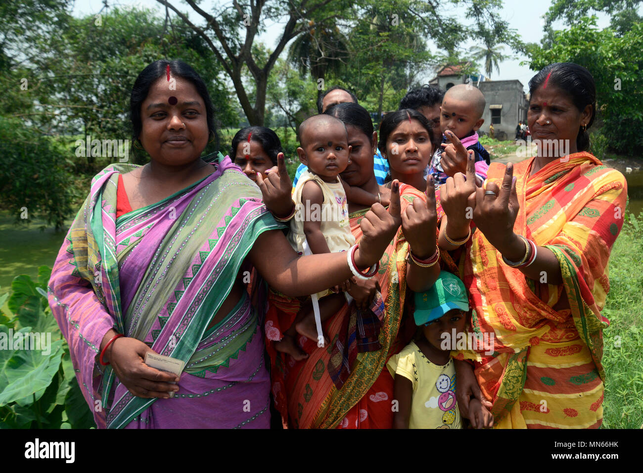 Kolkata, India. 14th May, 2018. Indian women show their inked finger after the casting their vote at Singur area of Hooghly district during the West Bengal Three Tier Panchayat Election 2018.Single phase Three Tier Panchayat Election 2018 held at the district of West Bengal, over all 72.5% polls recorded till the end. Credit: Saikat Paul/Pacific Press/Alamy Live News Stock Photo